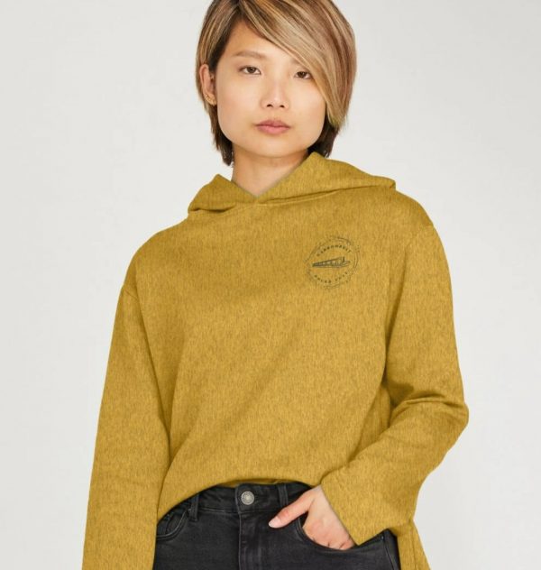 A photo of a woman wearing a sunflower yellow hoodie
