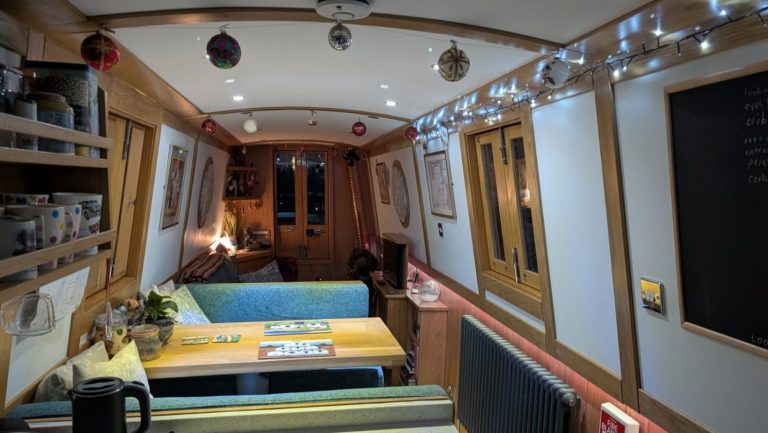 A photo of Christmas decorations inside a narrowboat