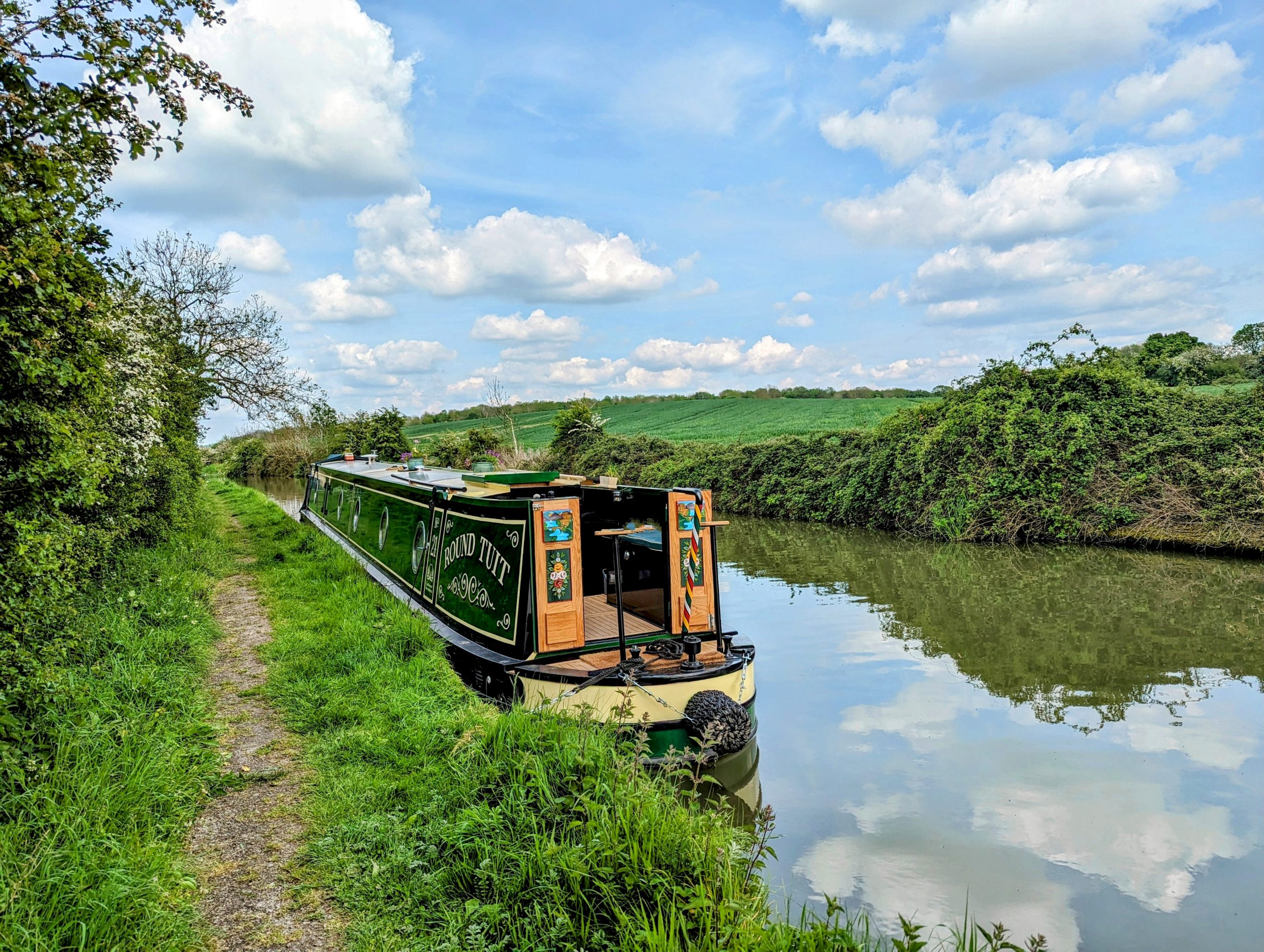 A photo of Narrowboat Round Tuit, moored on a rural towpath