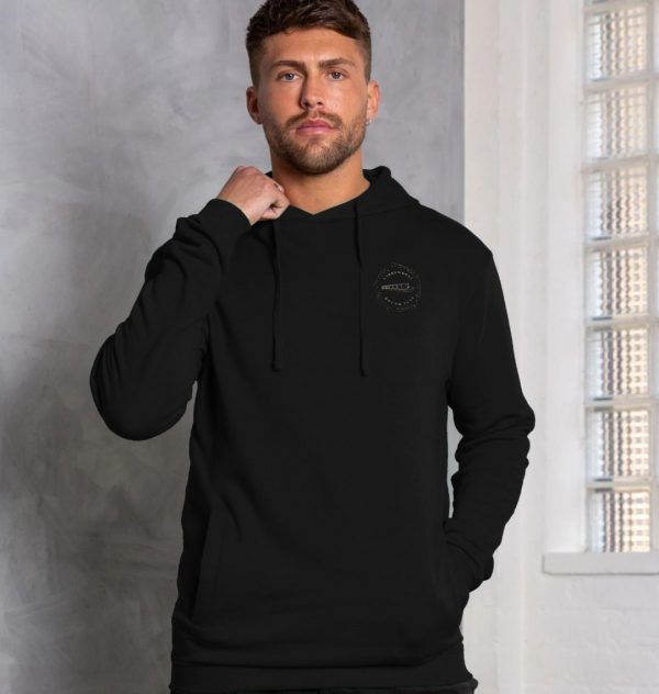 A photo of a man wearing a black hoodie