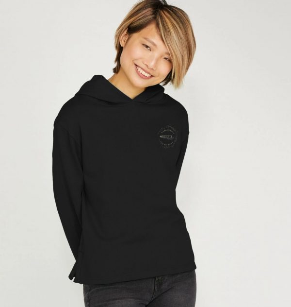 A photo of a woman wearing a black hoodie