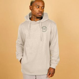 A photo of a man wearing an oat coloured hoodie