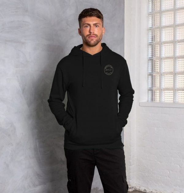 A photo of a man wearing a black hoodie