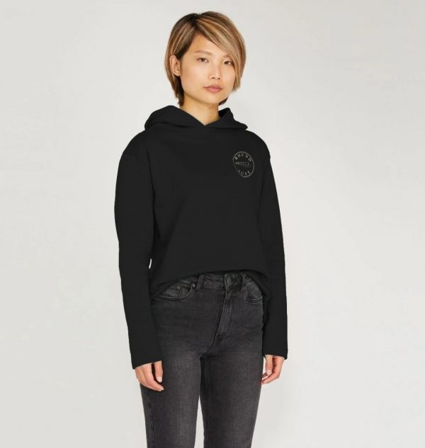 A photo of a woman wearing a black hoodie