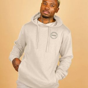 A photo of a man wearing an oat coloured hoodie