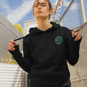 A photo of a woman wearing a black hoodie