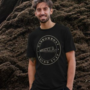 A photo of a man wearing a black t-shirt