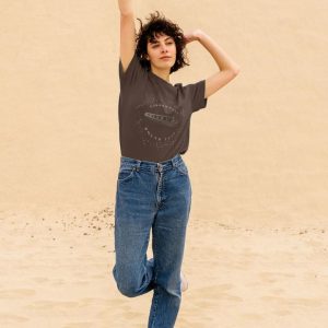A photo of a woman wearing a chocolate coloured t-shirt