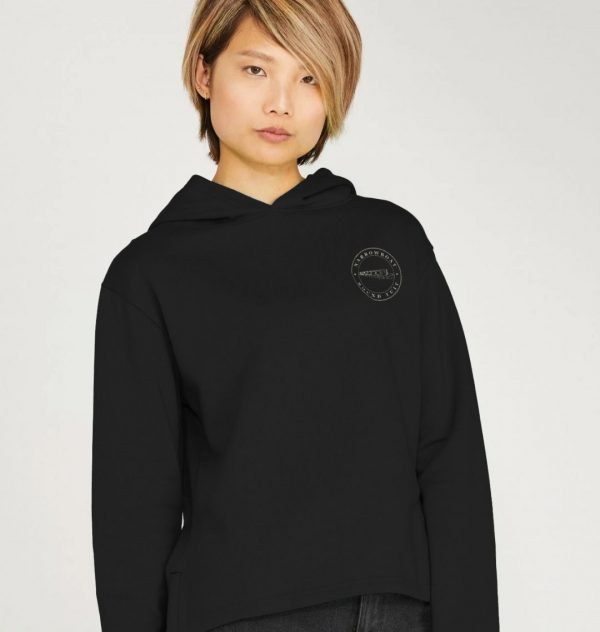 A photo of a woman wearing a black hoodie