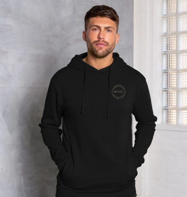 A photo of a man wearing a black hoodie