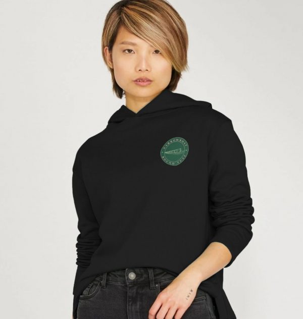 A photo of a woman wearing a black hoodie