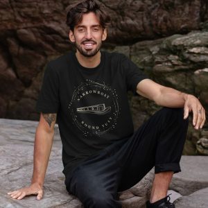 A photo of a man wearing a black t-shirt