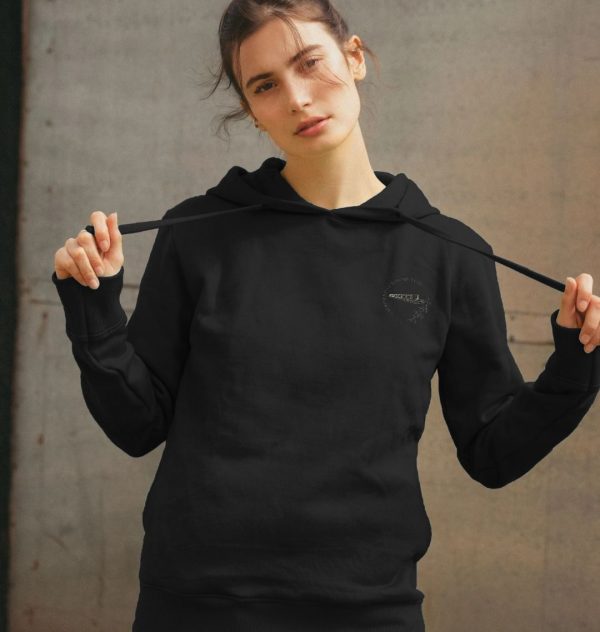 A photo of a woman wearing a black hoodie