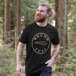 A photo of a man wearing a black t-shirt